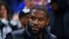 FILE - Boxer Floyd Joy Mayweather Jr. looks on during Game 1 of an NBA basketball first-round playoff series between the Toronto Raptors and the Philadelphia 76ers, Apr. 16, 2022, in Philadelphia.
