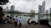 Vehicles of Sri Lanka's ruling party supporters are seen in a lake after being pushed into the water during a clash of pro and anti-government demonstrators, in Colombo, Sri Lanka, May 10, 2022. 