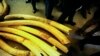 FILE - Ambassadors from European countries stand next to elephant tusks lying on the floor during a tour of ivory stockpiles in Harare, May 16, 2022. 