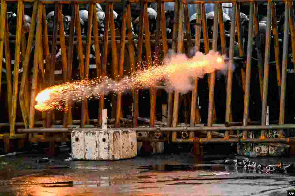 Police fire tear gas shells to disperse students taking part in an anti-government protest demanding the resignation of Sri Lanka's President Gotabaya Rajapaksa over the country's crippling economic crisis, in Colombo, May 29, 2022. 