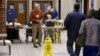 Voters arrive to cast their ballots in the U.S. Republican presidential primary at a polling station at Dreher High School in Columbia, S.C., Feb. 20, 2016. 