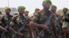 FILE - Cameroonian troops stand in formation in Douala, Feb. 20, 2014.