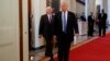 President Donald Trump, followed by Vice President Mike Pence, arrives for a meeting with manufacturing executives at the White House in Washington, Feb. 23, 2017.