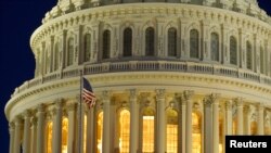 FILE - The United States Capitol Dome is seen before dawn in Washington, March 22, 2013.