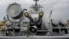 FILE - Russia's coat of arms, the double headed eagle, is seen on covers of the missile cruiser Moskva in the Ukrainian Black Sea port of Sevastopol, Sept. 16, 2008.