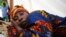 FILE - A cholera patient lies in a treatment center in Sierra Leone's capital Freetown.