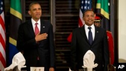 FILE - President Barack Obama and Tanzanian President Jakaya Kikwete stand for the national anthem during an official dinner at the State House in Dar es Salaam, Tanzania, July 1, 2013.