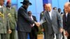 South Sudan's President Salva Kiir (3rd L) shakes hands with Sudan's President Omar al-Bashir as he arrives for talks at Khartoum Airport, Sept. 3, 2013.