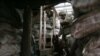 A Ukrainian Armed Forces serviceman and his dog enter a dugout on the frontline with the Russia-backed separatists near Zolote village, in Ukraine's eastern Luhansk region, Jan. 21, 2022.