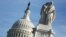 The figures of Grief and History stand atop the Peace Statue near the U.S. Capitol, Jan. 20, 2018. President Donald Trump and the U.S. Congress failed to reach a deal on funding federal agencies in Washington.
