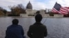 Tourists near the U.S. Capitol building in Washington D.C., Nov. 18, 2015. (J. Taboh/VOA)