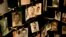 FILE - Family photographs of some of those who died in the Rwandan genocide hang in a display in a memorial center in Kigali, Rwanda, April 5, 2014.