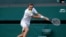 FILE - Russia's Daniil Medvedev in action during his third round match against Croatia's Marin Cilic, Wimbledon, July 3, 2021.