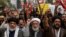 Shiite Muslims hold placards and shout during a protest march against the sectarian attacks in the Kurram district in Parachinar, the mountainous Khyber Pakhtunkhwa province, in Lahore, Pakistan, Nov. 22, 2024. 
