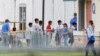 FILE - Immigrant children walk in a line outside the Homestead Temporary Shelter for Unaccompanied Children, a former Job Corps site that now houses them in Homestead, Florida, June 20, 2018.
