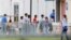 FILE - Immigrant children walk in a line outside the Homestead Temporary Shelter for Unaccompanied Children, a former Job Corps site that now houses them in Homestead, Florida, June 20, 2018.