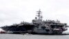 The U.S. aircraft carrier USS Ronald Reagan is anchored off Manila Bay, Philippine, for a port call Wednesday, Aug. 7, 2019. The USS Ronald Reagan is cruising in international waters in the South China Sea amid tensions in the disputed islands,…