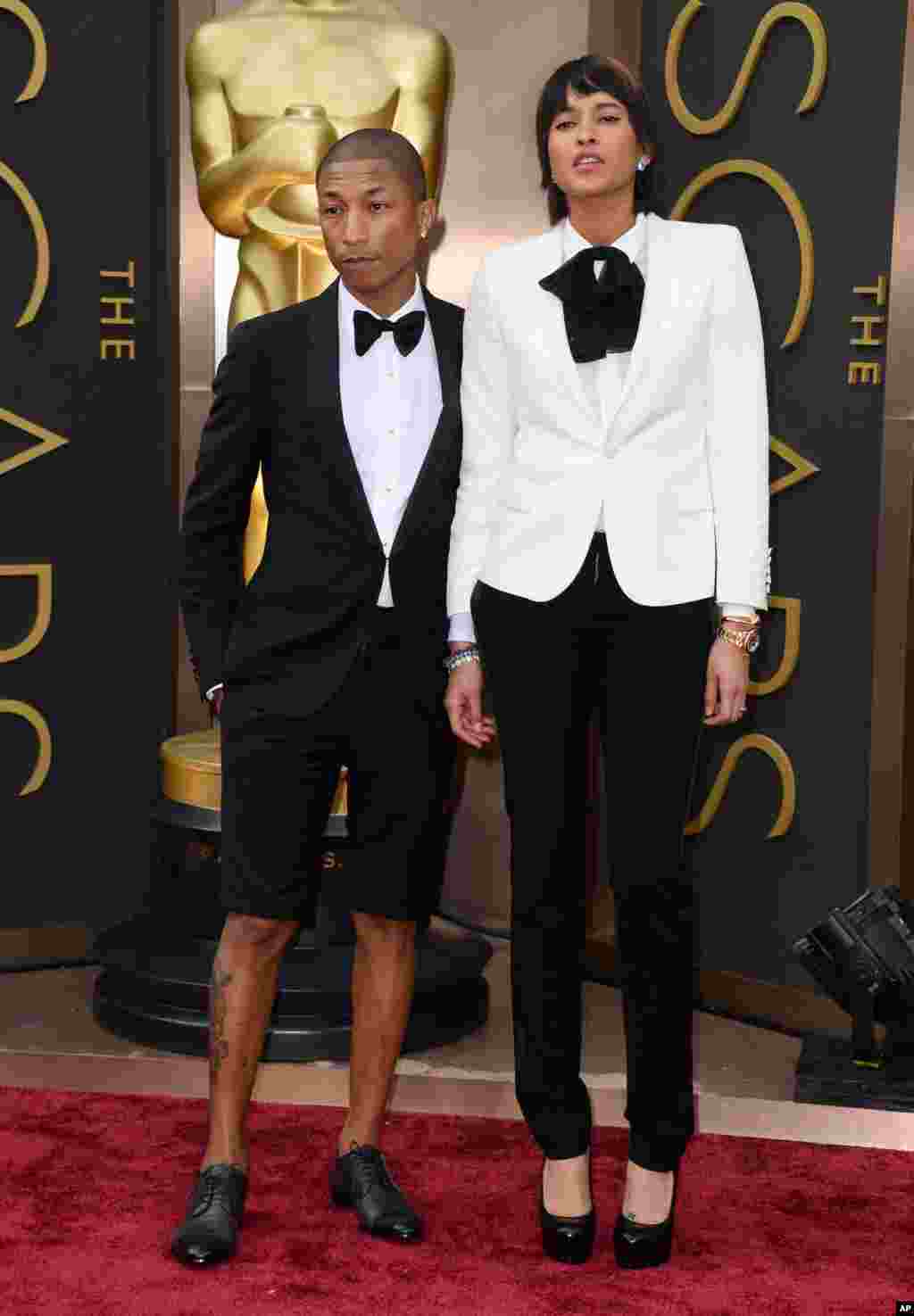Musisi dan nomine Oscar Pharrell Williams (kiri) dan Helen Lasichanh.