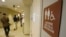 FILE - A sign marks the entrance to a gender neutral restroom at the University of Vermont in Burlington, Vermont. 