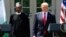 President Donald Trump and Nigerian President Muhammadu Buhari arrive for a news conference in the White House Rose Garden in Washington, April 30, 2018. 