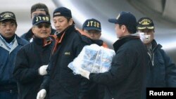 Protesters rally in front of the Press Syndicate in Cairo in support of Al Jazeera journalists Abdullah al-Shami and Mohamed Bader, who were detained by Egyptian authorities.