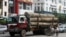 A truck loaded with teak logs runs on a road in Rangoon, Burma. U.S. Secretary of State announced the US will ease its import ban on Burma, Sept. 27, 2012.