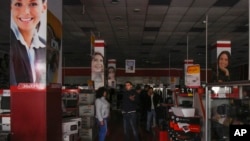 Customers are seen standing in an electronics store after a power failure, in Simferopol, Crimea, Nov. 22, 2015.