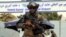 FILE - Taliban special force fighters stand guard outside the Hamid Karzai International Airport after the U.S. military's withdrawal, in Kabul, Afghanistan, Aug. 31, 2021.