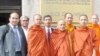 Thach Ngoc Thach, left and newly re-ordained monk Tim Sakhorn, middle, drops by VOA Khmer while on a visit in the US, file photo. 