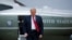 FILE - President Donald Trump walks from Marine One to board Air Force One, at Andrews Air Force Base, Maryland, May 14, 2020.