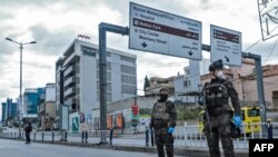 Security forces stand at a checkpoint in the city of Sulaimaniyah