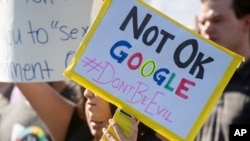 FILE- Workers protest against Google's handling of sexual misconduct allegations at the company's Mountain View, Calif., headquarters, Nov. 1, 2018.