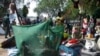 Displaced people gather inside a mosquito net tent as they flee from fighting between the South Sudanese army and rebels in Bor town, 180 km (112 miles) northwest from capital Juba December 30, 2013. South Sudanese rebels loyal to former Vice President Ri