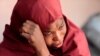 The mother of Muhammad Bello, one the students who was abducted by gunmen, reacts in Kankara, in northwestern Katsina state, Nigeria, Dec. 14, 2020.