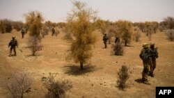 FILE - A photo taken on April 10, 2013 shows French soldiers taking part, 105 kms north of the northeastern Malian city of Gao, in an operation to find Islamist fighters. 