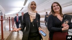 Rep. Ilhan Omar, D-Minn., walks to the chamber, March 7, 2019, on Capitol Hill in Washington.