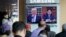 A TV screen shows images of U.S. President Donald Trump, left, and North Korean leader Kim Jong Un during a news program at the Seoul Railway Station in Seoul, South Korea, May 2, 2017.