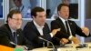 Greek Prime Minister Alexis Tsipras, center, speaks during a round table meeting at an emergency summit of eurozone heads of state and government at the EU Council building in Brussels, Belgium, July 7, 2015. 