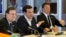 Greek Prime Minister Alexis Tsipras, center, speaks during a round table meeting at an emergency summit of eurozone heads of state and government at the EU Council building in Brussels, Belgium, July 7, 2015. 