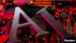 在这张图片中，人工智能缩写字母“AI”被放置在计算机主板上。（路透社2023年6月23日拍摄。）