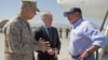 U.S. Secretary of Defense Leon Panetta, right, speaks with U.S. Ambassador Ryan Crocker, center, and General John Allen upon his arrival in Kabul, Afghanistan, June 7, 2012.