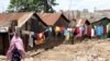 A woman walks on a street in the Korogocho slums in Kenya's capital Nairobi, April 6, 2011 file photo. 