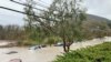 Cars are seen submerged in flood waters in Morro Bay, California, Jan. 9, 2023 in this picture obtained from social media. 