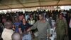 Uganda President Yoweri Museveni, center in military uniform, greets relatives of prison wardens during a graduation ceremony in the capital Kampala, Jan. 18, 2018. 