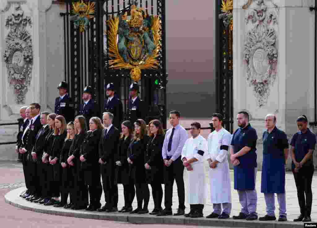Buckingham Palace household staff pay their respects during the State Funeral of Queen Elizabeth II on Sept. 19, 2022 in London. 