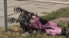 A stroller is seen lying on the ground after Russian missiles strike Vinnytsia, in central Ukraine, killing at least 20 people including three children, in this video grab taken from AFPTV footage July 14, 2022, and released July 15, 2022. 