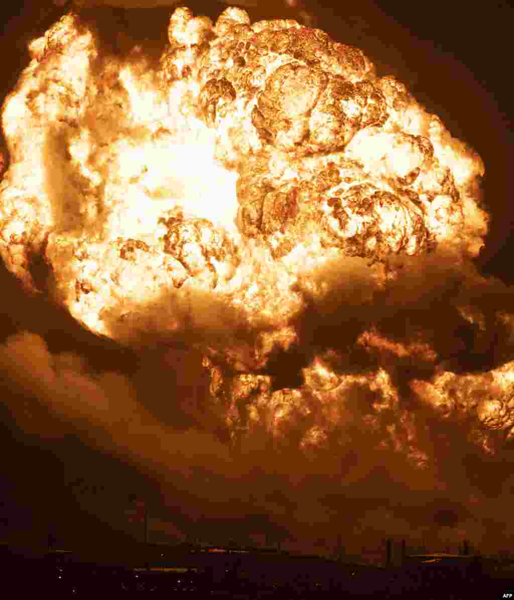 Flames rise from a massive fire at a fuel depot sparked by a lightning strike in Matanzas, Cuba, Aug. 8, 2022. 