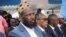 Former al-Shabab group co-founder and spokesperson Mukhtar Robow sits among colleagues after he was named as the minister in charge of religion by Prime Minister Hamza Abdi Barre in Mogadishu, Somalia, Aug. 2, 2022.