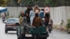Taliban fighters drive a car on a street following the killing of al-Qaida leader Ayman al-Zawahiri in a U.S. strike over the weekend, in Kabul, Afghanistan, Aug. 2, 2022.