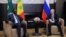 Russia's President Vladimir Putin (right) attends a meeting with Senegal's President Macky Sall, who is currently the chairman of the African Union, at the Bocharov Ruchei state residence in Sochi, Russia, June 3, 2022, in a Sputnik/Mikhail Klimentyev/Kre